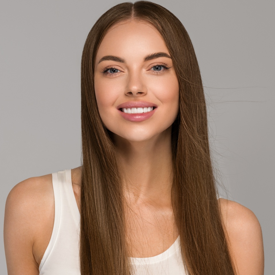 Beautiful woman teeth smile with healthy long hair beauty skin clean and fresh female young model portrait