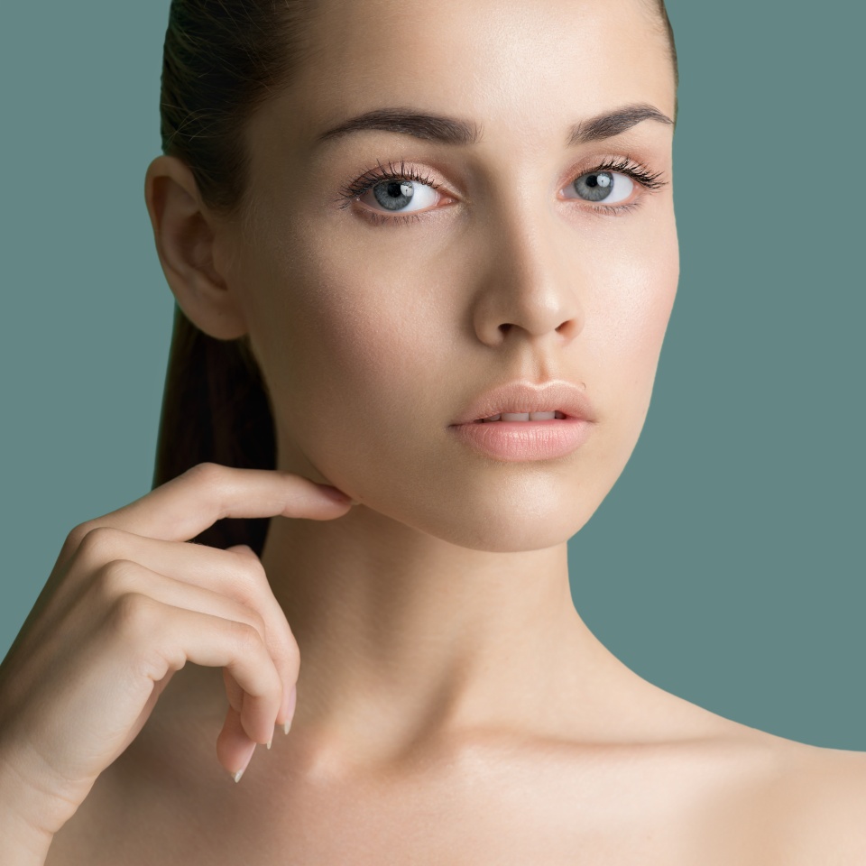 Beautiful young women with perfect fresh skin and makeup. Portrait of model with make-up, formed eyebrows and long eyelashes. Beauty and Spa, skincare and wellness. Selective focus