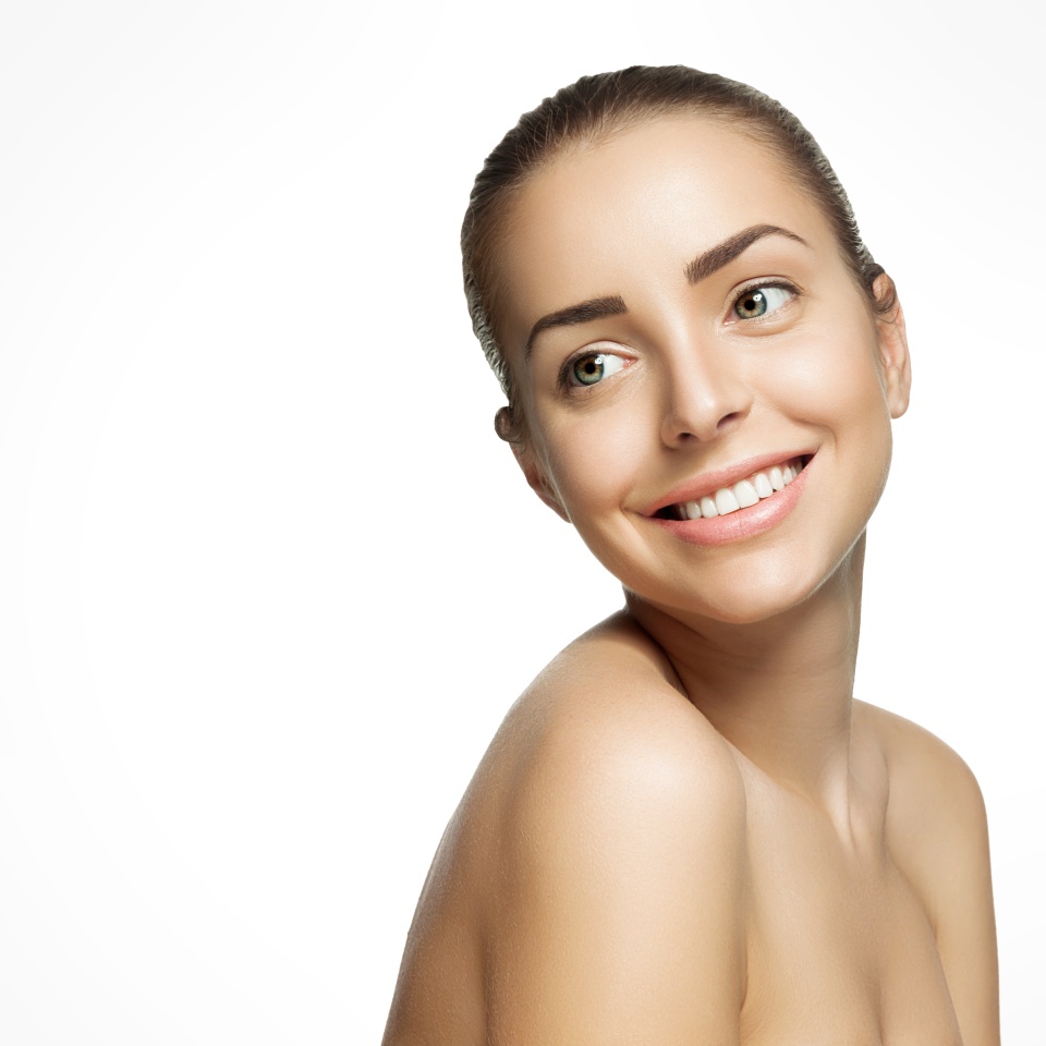 Portrait of beautiful smiling woman with pure healthy skin with natural make-up and white teeth
